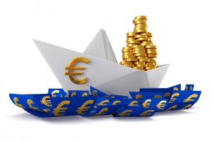 Conceptual paper boat floating in the euro currency and carries a large pile of coins isolated on a white background